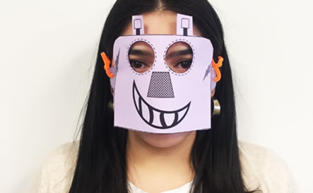 A girl with paper robot mask.